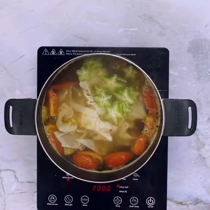 Bước 3 Nấu nước canh Canh cá lăng nấu măng chua